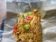 Mee goreng bungkus pedas manis dibungkus surat khabar gaya lama, penuh isi ayam dan sotong