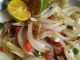 Ikan terubuk masin goreng garing disiram dengan tumisan bawang dan cili, siap untuk dihidang.
