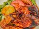 Ayam roasted yang digoreng garing keemasan, kelihatan rangup dan juicy.