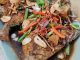 Ikan bawal digoreng garing sebelum disiram sos kicap Chinese style.